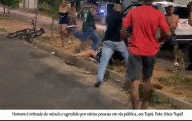 Homem Ã© retirado de veÃ­culo e agredido por vÃ¡rias pessoas em via pÃºblica, em TupÃ£